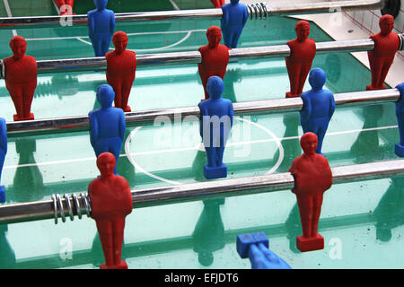 Close up of Soccer table game with blue and red players Stock Photo