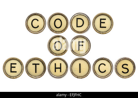 code of ethics text  in old round typewriter keys isolated on white Stock Photo