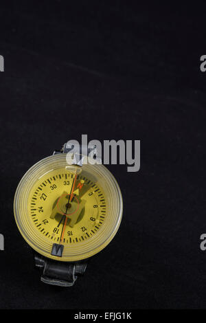 Vintage German WW2 airforce pilot wrist compass on black velvet background Stock Photo