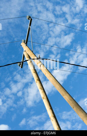 New wooden utility pole with power line wires and support against Stock ...