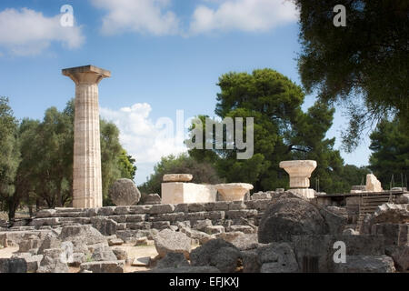 Ruins of the Temple of Zeus, with its single reconstructed Doric column at Ancient Olympia, The Peloponnese, Greece Stock Photo