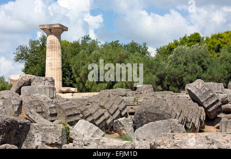 Ruins of the Temple of Zeus, with its single reconstructed Doric column at Ancient Olympia, The Peloponnese, Greece Stock Photo