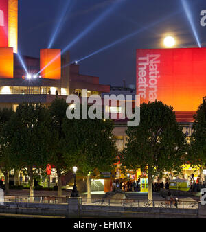 Royal National Theatre with red lights at night, Waterloo Bridge, Bankside, London, England Stock Photo