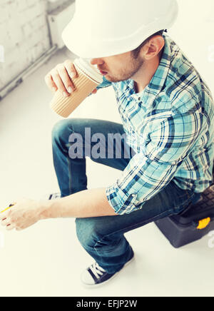 builder drinking take away coffee Stock Photo