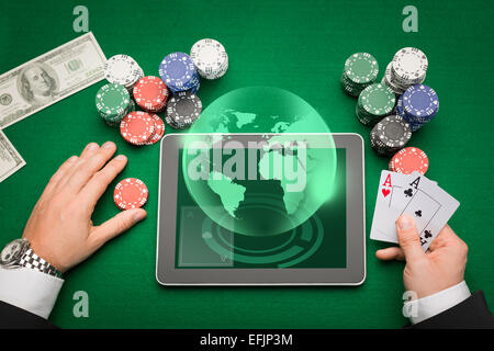 casino poker player with cards, tablet and chips Stock Photo