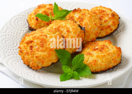 Coconut cookies dipped in dark chocolate Stock Photo