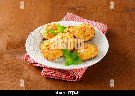 Coconut cookies dipped in dark chocolate Stock Photo