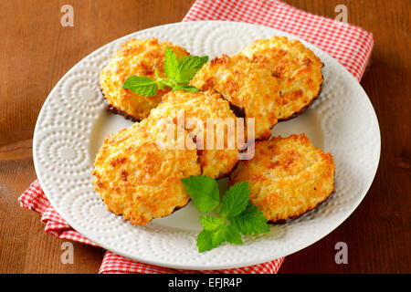 Coconut cookies dipped in dark chocolate Stock Photo
