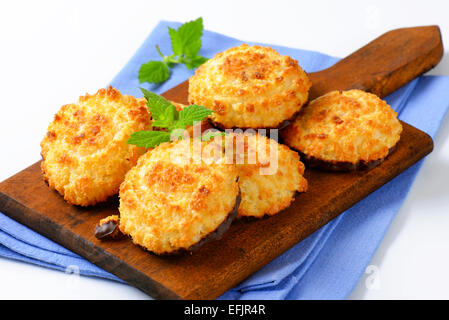 Coconut cookies dipped in dark chocolate Stock Photo
