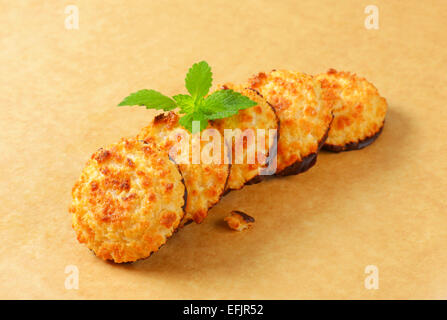 Coconut cookies dipped in dark chocolate Stock Photo