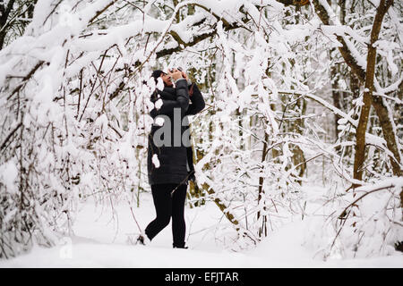 Girl photographed in snowy forest Stock Photo