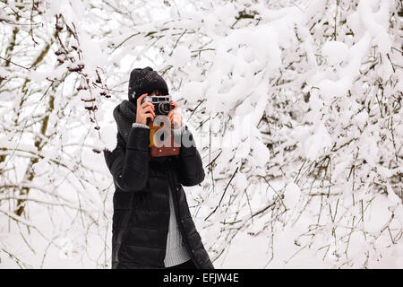 Girl photographed in the winter forest Stock Photo