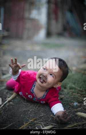 A little girl fallen into dust Stock Photo