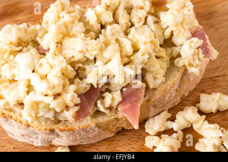 Sandwich, tapas with scrambled eggs and ham Stock Photo