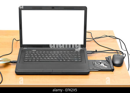 laptop on a table with an open drive isolated on white background Stock Photo