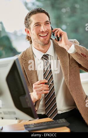 Man working in office Stock Photo