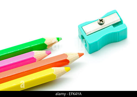 Colored pencils and sharpener isolated on white background close up Stock Photo