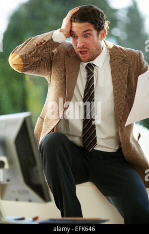 Man stressed out at work Stock Photo
