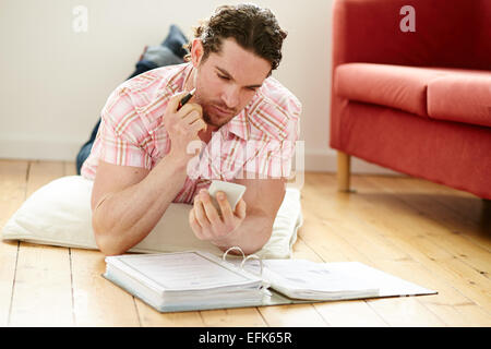 Male working out finances Stock Photo