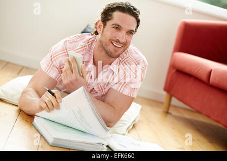 Male working out finances Stock Photo