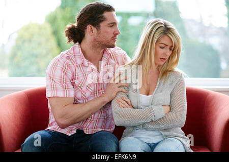 Man consoling woman Stock Photo