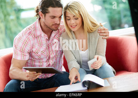Couple working out finances Stock Photo
