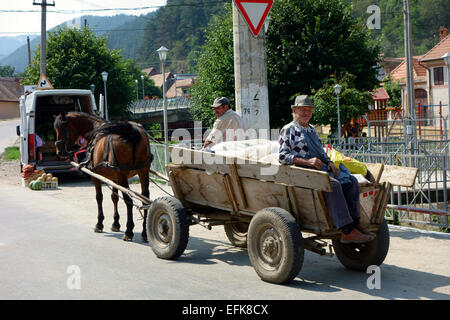 Local people traveling by horse cart, Romania, Eastern Europe Stock Photo