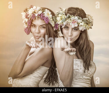 Two beautiful spring fairy , brides sending a kiss to you Stock Photo