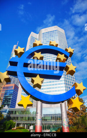 FRANKFURT - OCTOBER 14: Euro sign in front of the European Central Bank building on October 14, 2014 in Frankfurt, Germany. Stock Photo