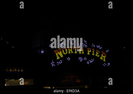 Night view electric lights 'North Pier' name above entrance to North Pier, North Promenade, Blackpool Illuminations, UK Stock Photo