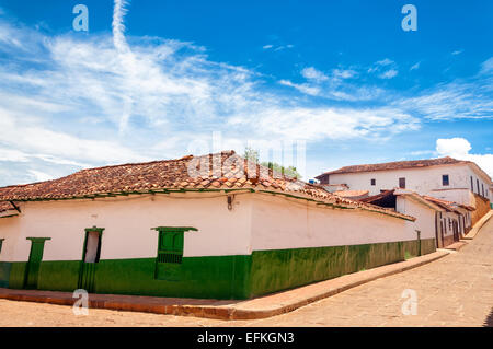 Green and white colonial buildings in Barichara, Colombia Stock Photo