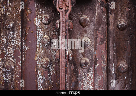 Rusted metal background with bolts and rivets Stock Photo
