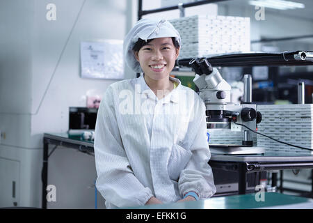 Portrait of worker in factory that specialises in creating functional circuits on flexible surfaces Stock Photo