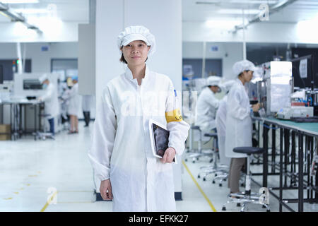 Portrait of worker in factory that specialises in creating functional circuits on flexible surfaces Stock Photo
