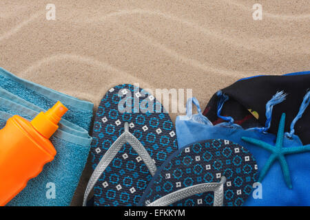 Accessories for the beach lying on the sand, with place for your text Stock Photo