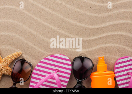 Accessories for the beach lying on the sand, with place for your text Stock Photo