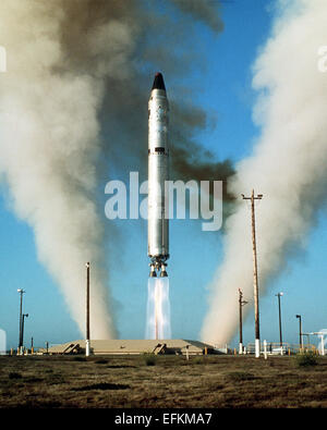 An Air Force Titan II intercontinental ballistic nuclear missile II missile with a W53 warhead fit into the Mk-6 re-entry vehicle launched during a test at Vandenberg Air Force Base January 1, 1975 in Vandenberg, California. Stock Photo