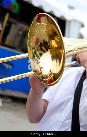 Musician playing trombone in a marching band Stock Photo