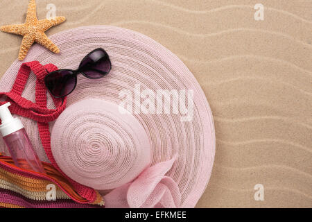 Accessories for the beach lying on the sand, with place for your text Stock Photo
