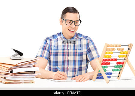 Man counting on abacus and writing down some notes isolated on white background Stock Photo