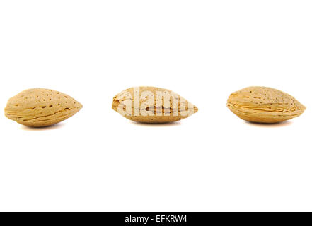 Three almonds on white background Stock Photo