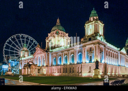 Belfast City Hall illuminated at night.  Taken in 2009 when the 'Belfast Wheel' was sited on the City Hall grounds. Stock Photo