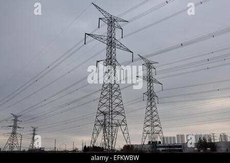 Hydro towers and high tension electricity power lines in an industrial park with cloudy sky Vaughan Canada Stock Photo
