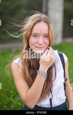 Young cute teen girl portrait outdoors. Stock Photo