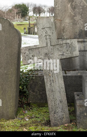 Old stone cross in cemetery Stock Photo