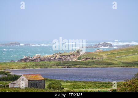 Stormy ocean waves on rocky coastline, Isles of Scilly, Cornwall, UK Stock Photo