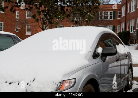 Parked cars covered in snow - Virginia USA Stock Photo