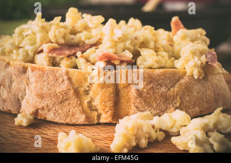 Sandwich, tapas with scrambled eggs and ham Stock Photo