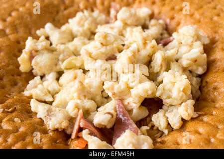 Sandwich, tapas with scrambled eggs and ham Stock Photo