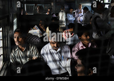 Commuters on a suburban train in Mumbai, India Stock Photo